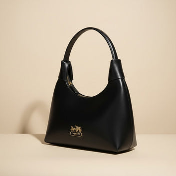 Elegant Black Leather Handbag with Gold Accents